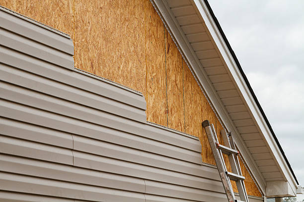 Professional Storm Damage Siding Repair technician working in Long Beach, NY